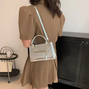 Silver metallic mini tote bag featuring crocodile embossed leather and golden hardware details