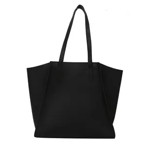 Bolso tote de cuero negro minimalista de gran capacidad con diseño de forma trapezoidal