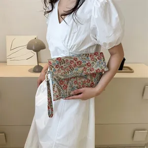 Retro floral envelope clutch bag with red and blue embroidery and gold metal flower buckle