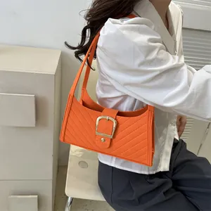 Bright orange felt shoulder bag with striped stitching and golden metal buckle for women
