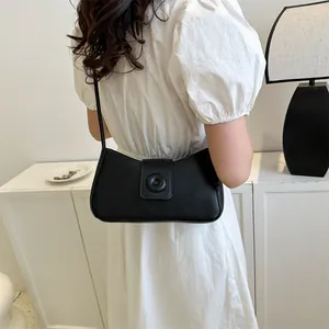Minimalist black rectangular underarm bag with circular buckle for women's summer style
