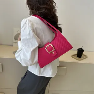 Fuchsia felt tote shoulder bag with quilted texture and large gold buckle detail