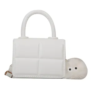 Minimalist white quilted mini handbag with 3D texture and cute plush ball charm
