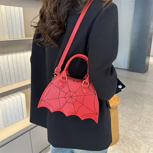Chic red bat-shaped handbag with spider web embroidery and adjustable strap
