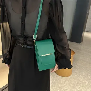 Minimalist bright green crossbody mobile phone bag with gold metal trim and leather strap