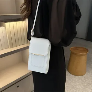 Minimalist white small PU leather crossbody bag with thin adjustable shoulder strap for women