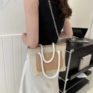 Sac à épaule en paille tissée avec poche en cuir et poignées en corde de coton