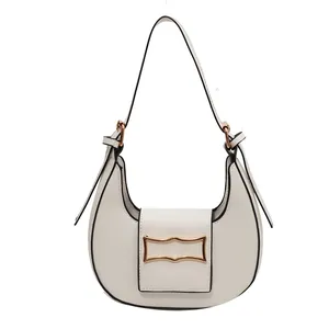 Minimalist white crescent underarm bag with gold wave hardware and black edge paint
