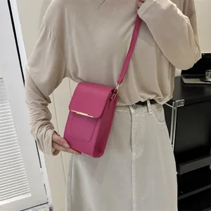 Minimalist rose pink leather crossbody bag with elegant gold metal trim for women