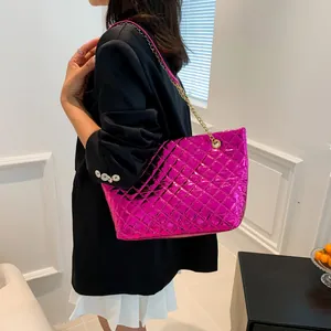 Metallic hot pink quilted tote bag with gold chain strap for stylish modern women