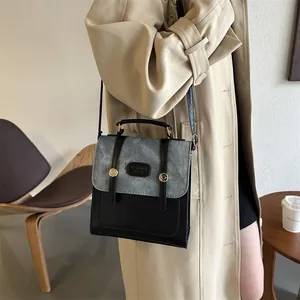 Vintage denim and black leather patchwork handbag with gold buckles for women