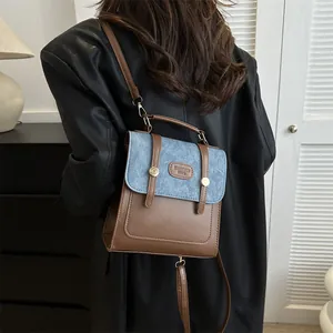 Retro style crossbody small square bag with brown leather and blue denim patchwork design