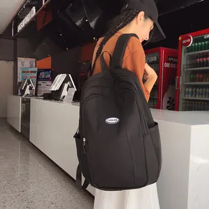 Minimalist large-capacity black backpack with fashion patch for students school life