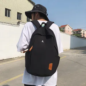 Minimalist black nylon backpack with letter A print for students and daily casual travel