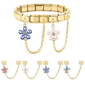 Gold stainless steel modular charm bracelet with enamel flower and evil eye pendants