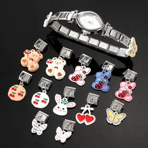 Detailed view of silver stainless steel modular bracelet with colorful cartoon charms