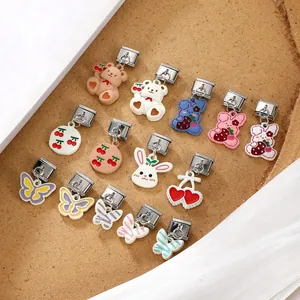 Detailed macro view of colorful Italian charm links with cartoon animals and fruit patterns