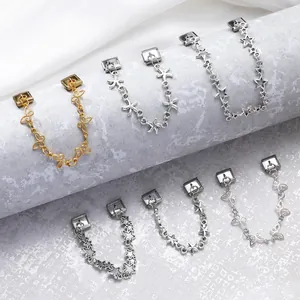 Italian charm bracelet links featuring gold butterfly and silver starfish charms on satin