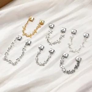 Italian charm bracelet links featuring gold and silver stars, butterflies and starfish charms