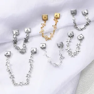 Detail of Italian modular charms featuring stars, butterflies, and starfish designs