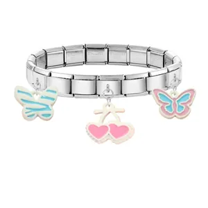 Close-up of stainless steel modular bracelet with enamel butterfly and cherry charms