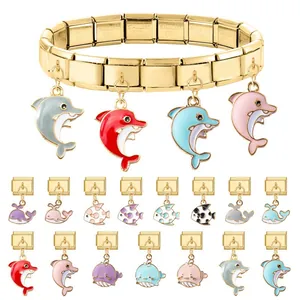 Bracciale componibile italiano dorato con ciondoli smaltati a forma di delfino e pesci