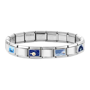 Macro detail of stainless steel modular bracelet with colorful ocean theme enamel charms