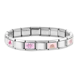 Macro shot of stainless steel Italian charm bracelet with cute pink sea animal patterns