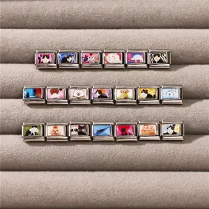 Macro shot of stainless steel Italian charm links with cute cartoon cat and dog patterns