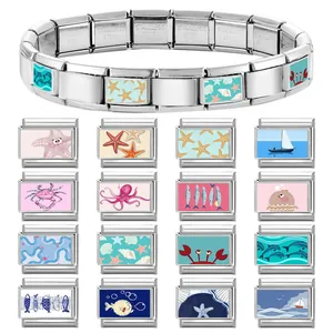 Italian charm bracelet with 16 sea life charms in stainless steel on white background