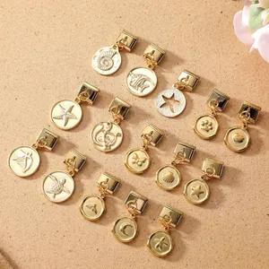 Macro view of 15-piece golden alloy modular charms featuring sea creatures and nature designs