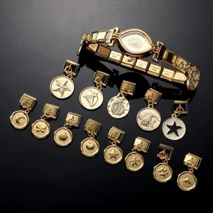 Detail of gold stainless steel watch band and 13 unique DIY charms on a dark background