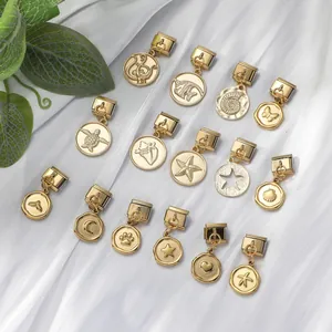 Detailed close-up of 15-piece gold modular charms featuring ocean and nature motifs