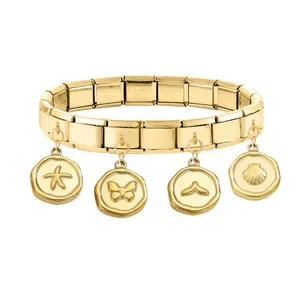 Detailed view of gold stainless steel charm bracelet with ocean themed pendants
