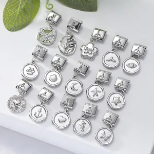 Close-up of Italian charm link bracelets with silver pendants like butterfly and star