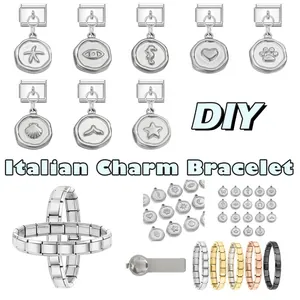 Macro detail of modular Italian charm bracelets with engraved circular pendants in five metal tones