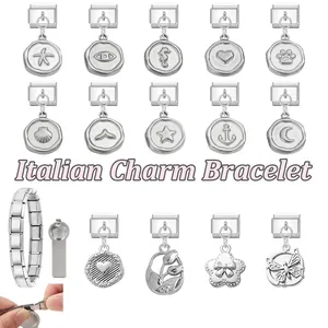 Detailed macro view of silver Italian charm bracelet links with various sea and heart charms