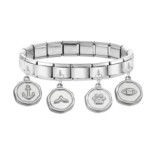 Detail of Italian modular stainless steel bracelet with engraved round charms on white background