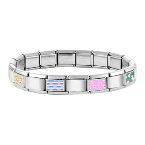 Detail of modular stainless steel bracelet links with colorful enamel floral patterns