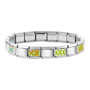 Detail of Italian charm bracelet links with colorful floral patterns and stainless steel finish