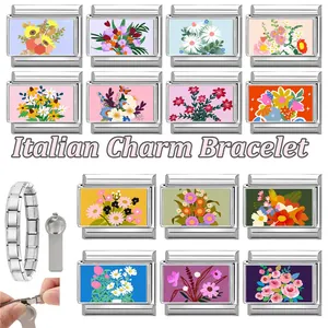 Macro view of modular Italian charm bracelet links with colorful floral patterns