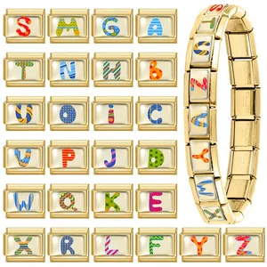 Macro view of modular stainless steel links with colorful alphabet charms for DIY bracelets