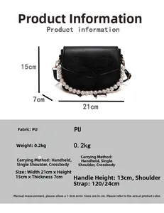 Details einer schwarzen Handtasche mit Perlen griff und Maßen von 21x15x7 cm