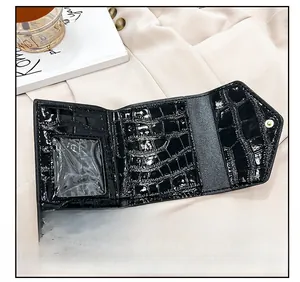 Detail view of the black crocodile pattern wallet interior with multiple card slots