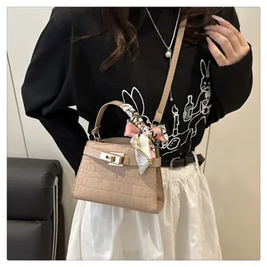 Chic apricot crocodile texture crossbody bag with silk scarf and gold twist lock