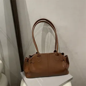 Brown faux leather shoulder bag with vintage pleated details for daily office commuting