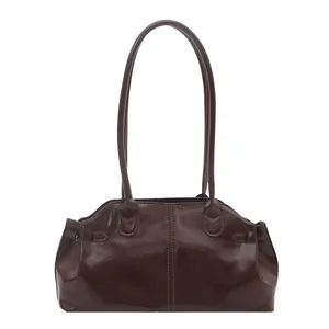 Deep brown glossy leather tote bag with vintage minimalist design and long shoulder straps