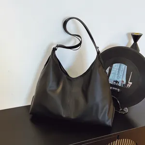 Minimalist large black leather hobo tote bag for women with adjustable shoulder strap