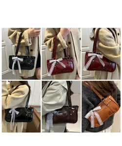 Lace bow and stud accents on chic rectangular shoulder bags in various vintage colors