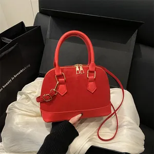 Elegant red dome handbag for women with leopard texture and gold hardware details
